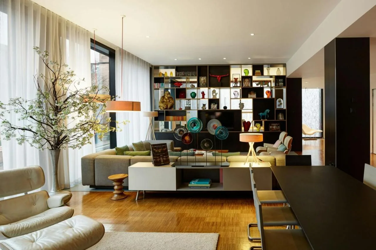 a living room with a couch and a table at citizenM Glasgow in Glasgow